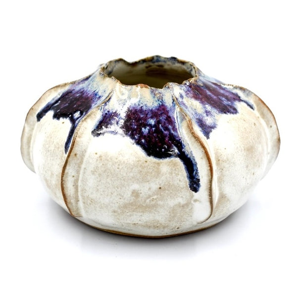 Rose apple shaped porcelain bud vase in cream with a touch of purplish blue glaze, available at Cerulean Arts. 