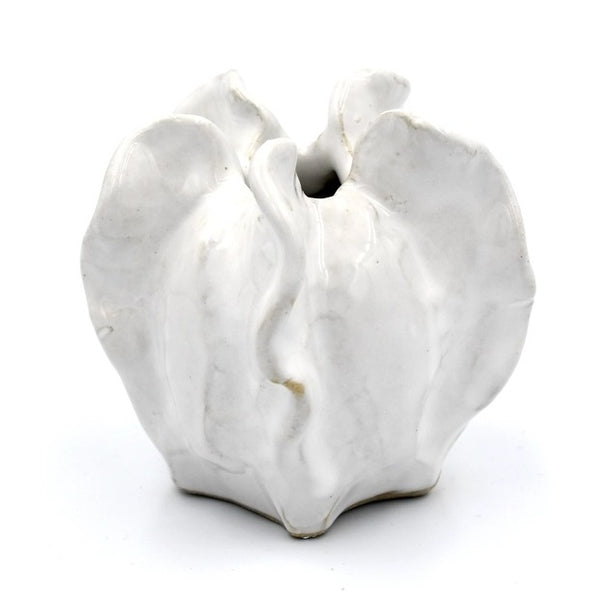 Mini luffa-shaped porcelain bud vase in white glaze, available at Cerulean Arts. 