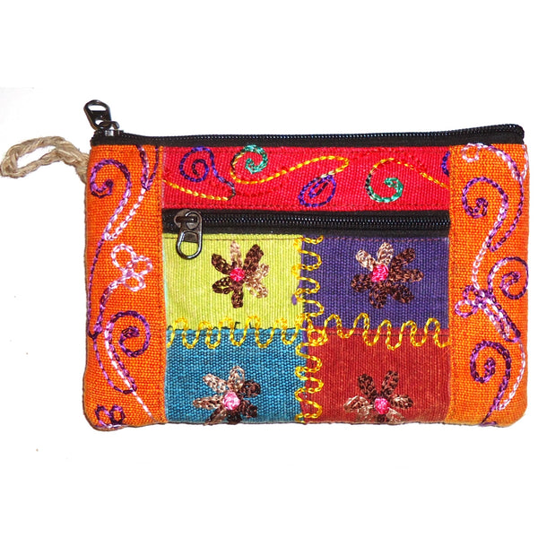 Multi-colored cotton clutch purse embroidered with bright flowers available at Cerulean Arts.