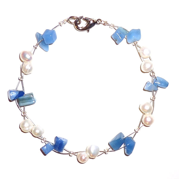 White pearl and blue stone chip bracelet on wire cord available at Cerulean Arts.