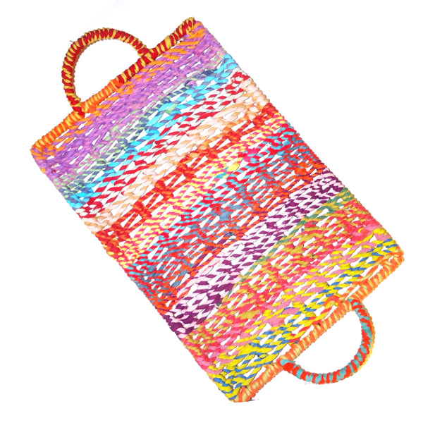 Large, shallow rectangular tray woven in multi-colored jute with handles available at Cerulean Arts.