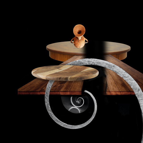 inkjet print depicting a dramatically lit pot, wooden tables and curved shapes floating in a black space