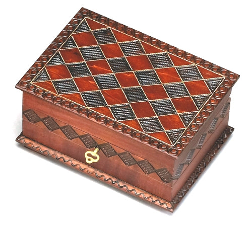 Decorative wooden box with checkered diamond pattern and keyed closure.