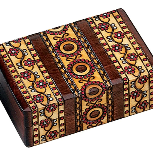 Decorative wooden box with intricate patterns.