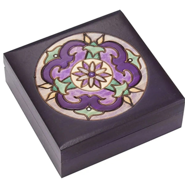 Decorative purple box with a circular mandala design.