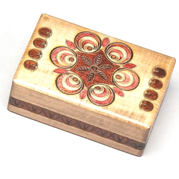 Wooden box with decorative patterns.