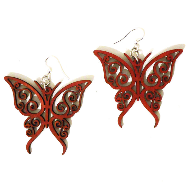 Laser cut wood earrings with magenta butterfly design available at Cerulean Arts.  
