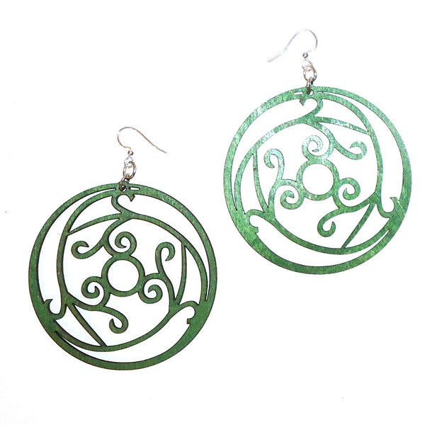 Laser cut wood earrings with kelly green optical filigree design available at Cerulean Arts. 