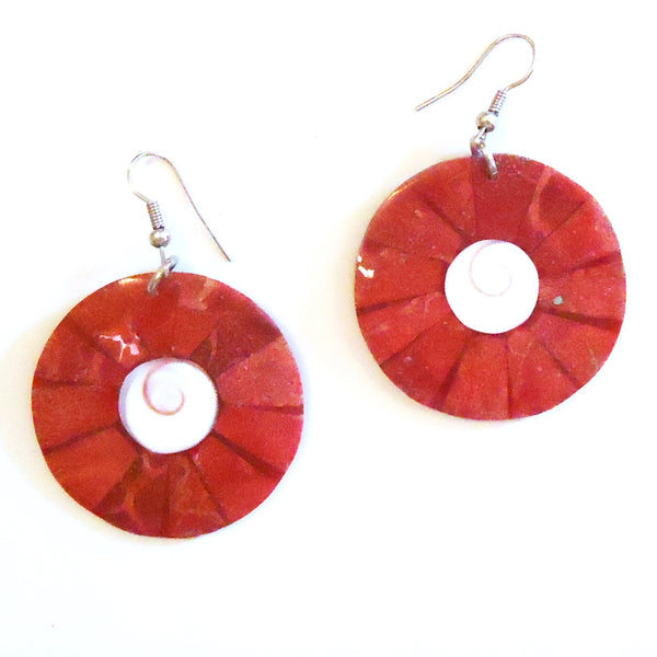 Round shell earrings with red sunburst pattern and white spiral center available at Cerulean Arts.