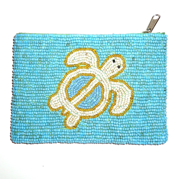 Beaded coin purse with sea turtle design against a turquoise background, available at Cerulean Arts.