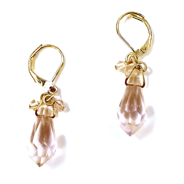Silver earrings with teardrop-shaped pink crystals