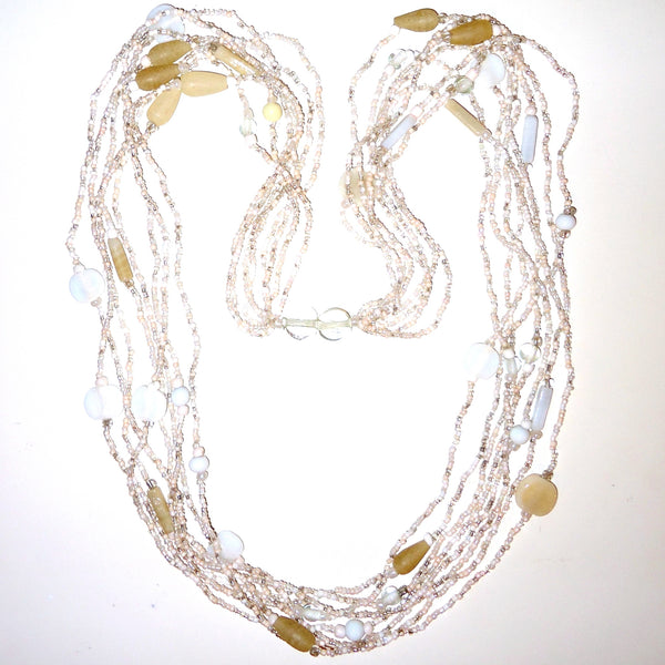 Multi bead necklace in shades of white, gray and cream, available at Cerulean Arts.