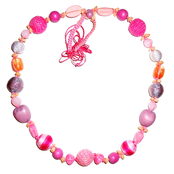 Multi bead necklace in shades of pink, metallic silver and purple available at Cerulean Arts.