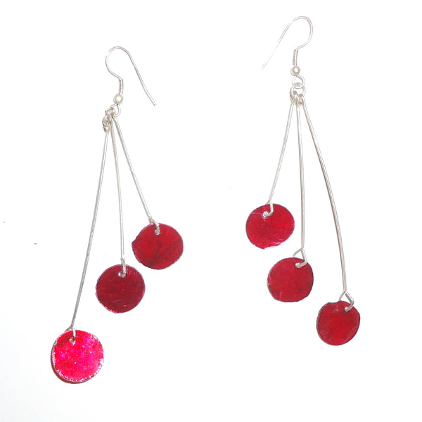 Three red capiz shell discs on silver colored wire earrings, available at Cerulean Arts.&nbsp; Silver colored wires.