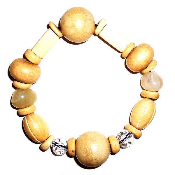 Multi bead bracelet in light natural wood tones with cream accents available at Cerulean Arts.