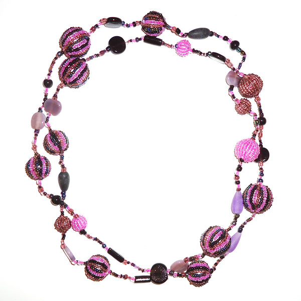 Multi bead necklace in shades of purple, black and pink available at Cerulean Arts.