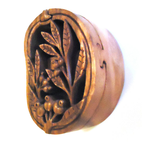 Puzzle keepsake box featuring a carved wood floral design, available at Cerulean Arts.