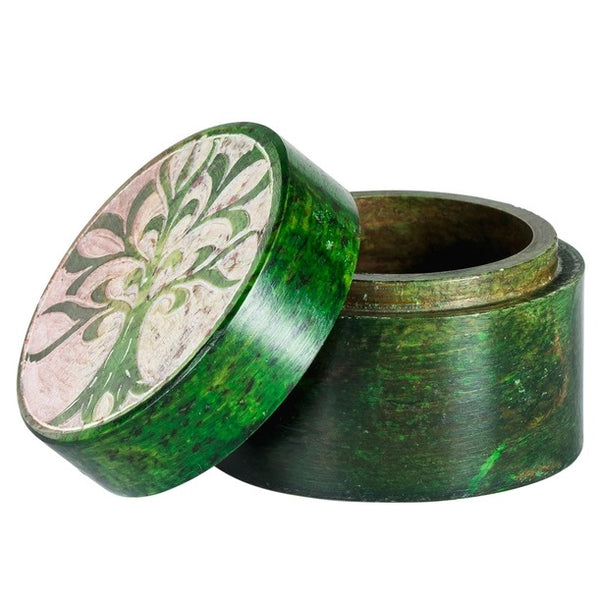 Round soapstone box stained in green and carved with tree of life pattern on the lid,