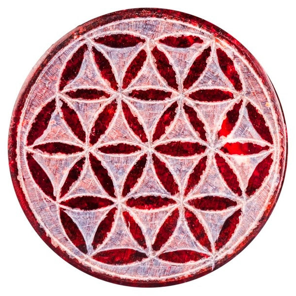 Round soapstone box stained in red carved with flower of life pattern on the lid, available at Cerulean Arts.