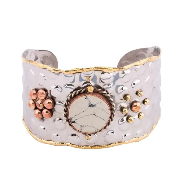 Metal cuff bracelet with center marble stone, available at Cerulean Arts.