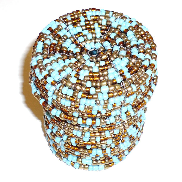 Beaded cylindrical container with turquoise and gold beads.