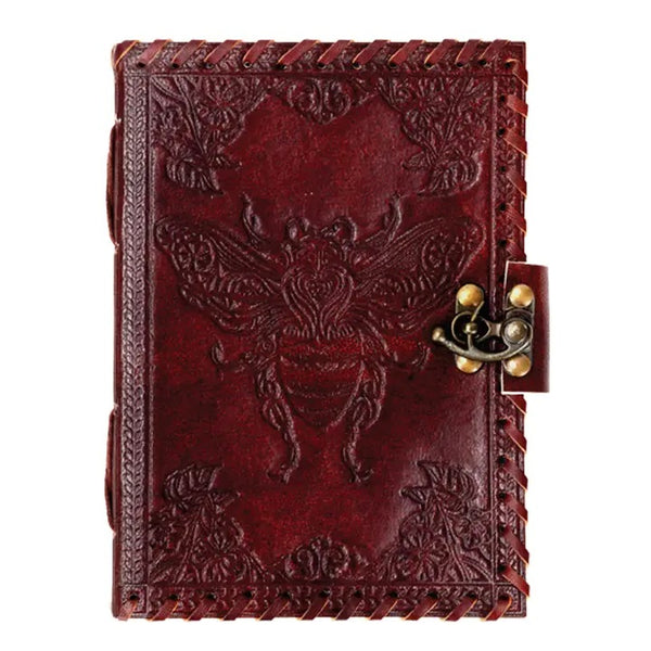 Brown leather journal with embossed bee design and metal latch.