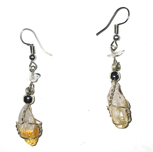 Pair of earrings with yellow teardrop-shaped gemstones