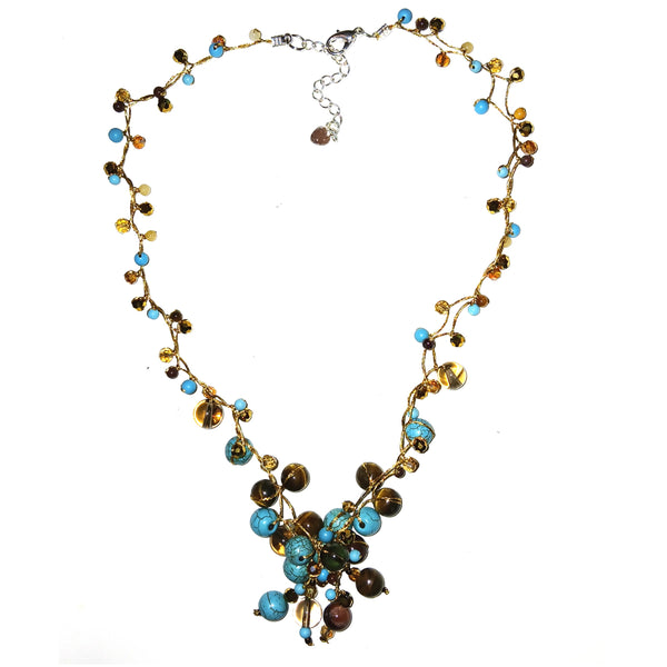 Necklace with multicolored beads on a silk cord.