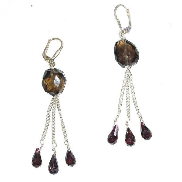 Pair of earrings with brown and red gemstones