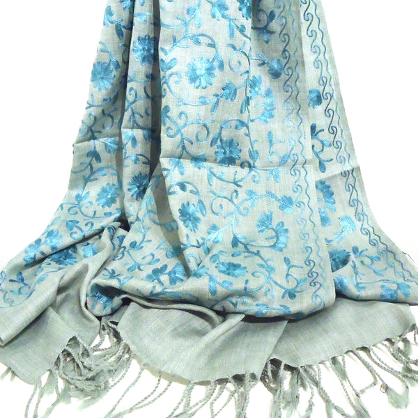 Silver gray wool shawl with embroidered floral pattern in aqua available at Cerulean Arts. 