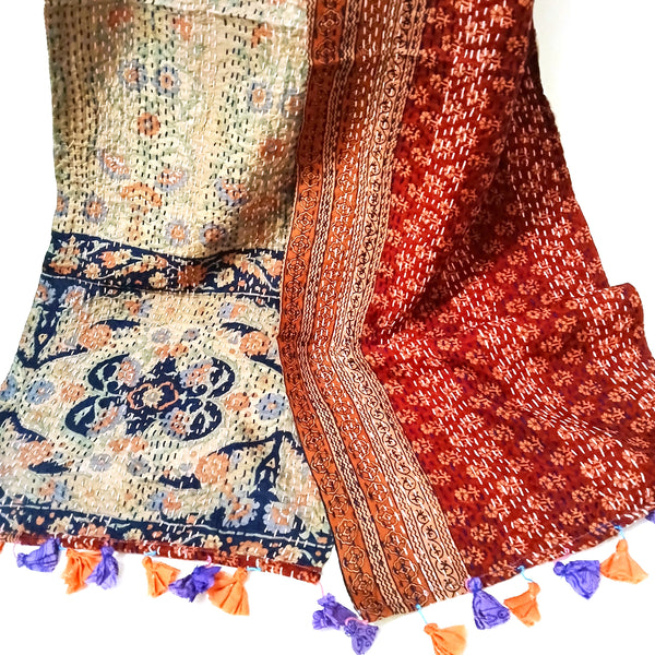 Intricately patterned double sided scarf with tassels 