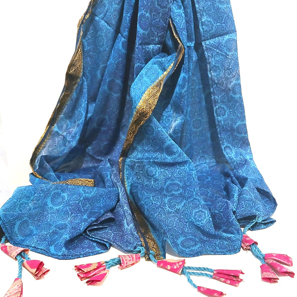 Blue silk scarf with gold edge band and pink tassels.