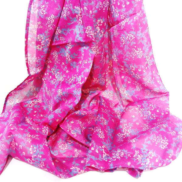 Bright fuchsia silk scarf with tiny flower pattern.