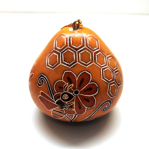 Decorative gourd ornament with bee and honeycomb design 
