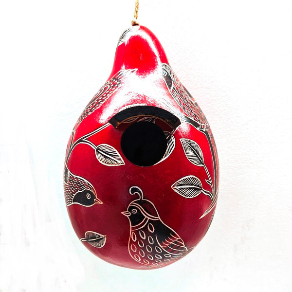 Red decorative gourd birdhouse with black and white bird designs