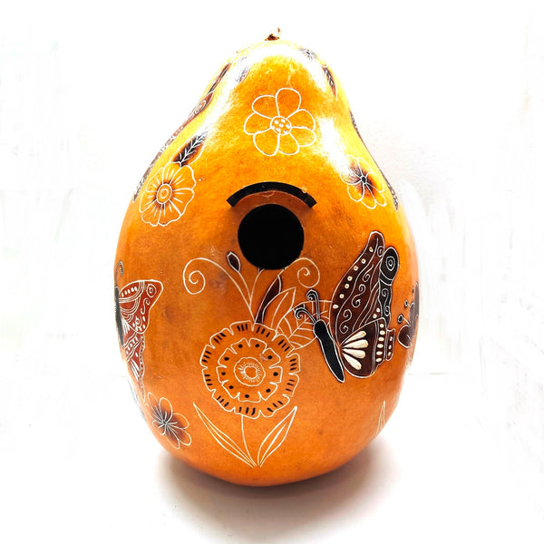 Decorative yellow gourd birdhouse with hand carved floral and butterfly designs 