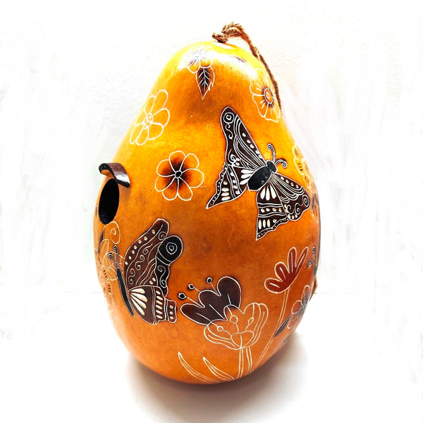 Decorative yellow gourd birdhouse with hand carved floral and butterfly designs