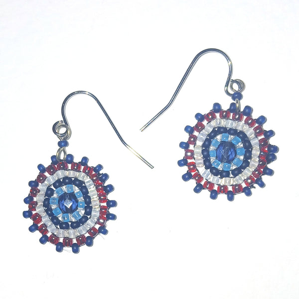 Beaded earrings with a circular design in rpink, white, and blue 