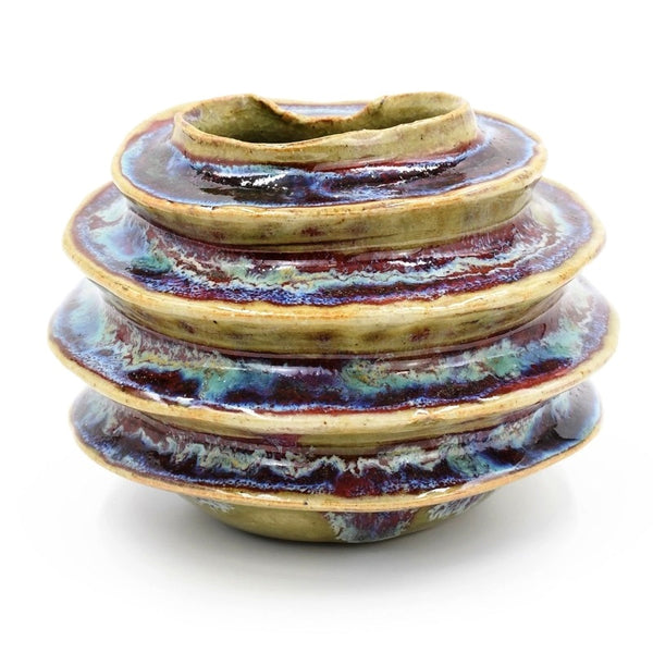 Luffa ring-shaped porcelain bud vase in variegated green and purple glaze, available at Cerulean Arts. 