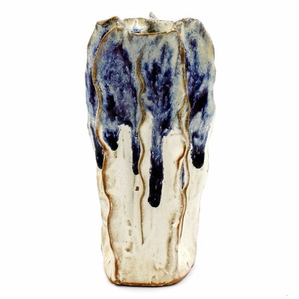 Tall luffa-shaped porcelain bud vase in cream with a touch of blue glaze, available at Cerulean Arts.  