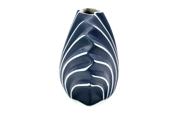 Shell-shaped porcelain vase with ribbed design in navy blue with white stripe available at Cerulean Arts.