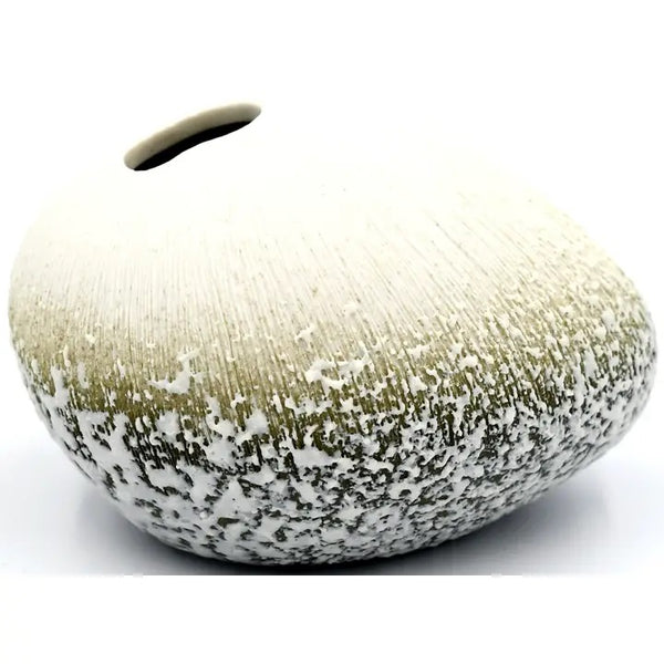 Decorative vase with textured surface in white and green