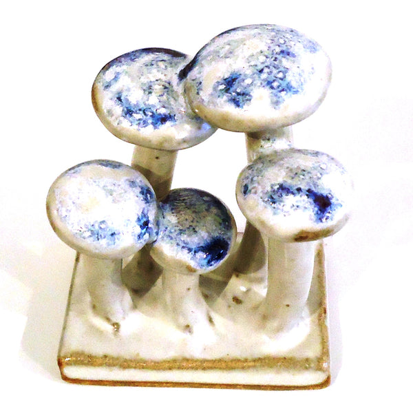 Ceramic mushroom figurine with milky purple speckled caps