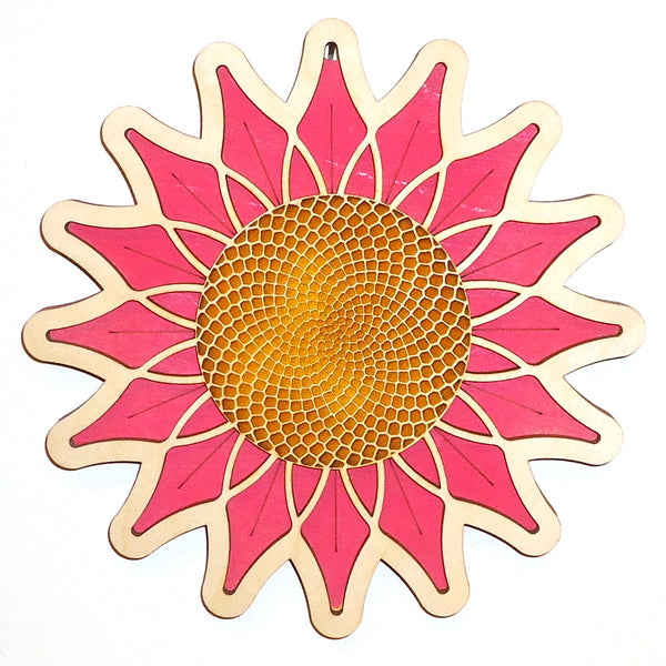 Laser-cut pink daisy wood trivet by veteran Robert E. Jones of Baltic by Design, available at Cerulean Arts.  