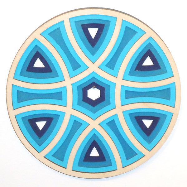 Laser-cut stepped blue wood trivet by veteran Robert E. Jones of Baltic by Design, available at Cerulean Arts. 