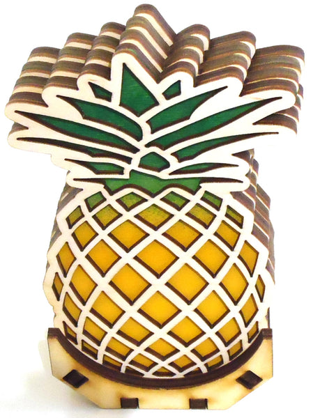 Laser-cut wood pineapple coaster set of four with stand by veteran Robert E. Jones of Baltic by Design, available at Cerulean Arts. 