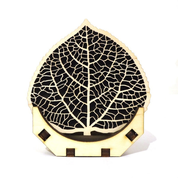 Laser-cut wood aspen leaf coaster set of four with stand by veteran Robert E. Jones of Baltic by Design, available at Cerulean Arts. Handmade in Maine.  