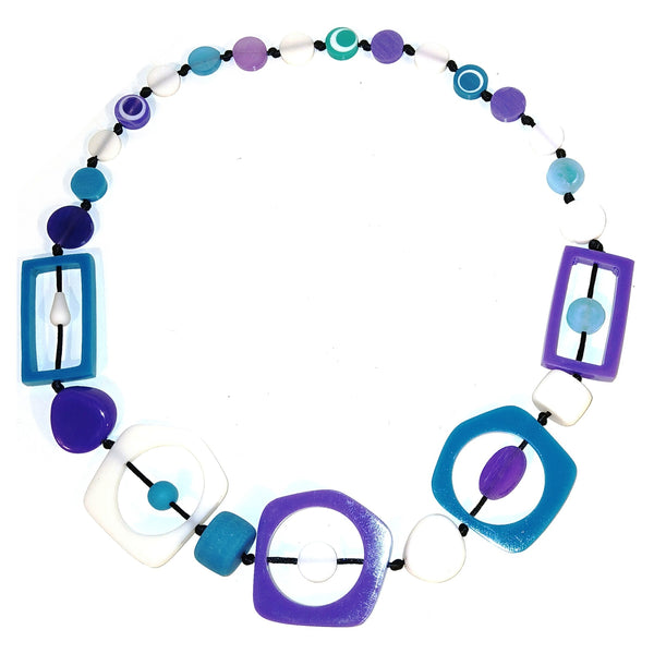A colorful geometric beaded necklace featuring purple, blue, and white circular, square, and rectangular bead.
