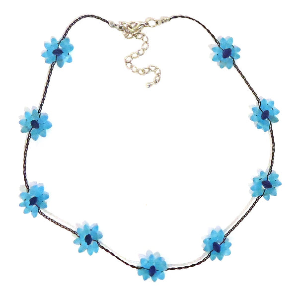 Necklace with blue seaglass flowers delicately strung on waxed linen cording available at Cerulean Arts. 