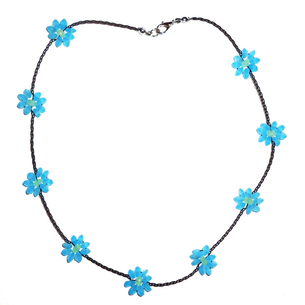 Necklace with blue seaglass flowers delicately strung on waxed linen cording available at Cerulean Arts.  
